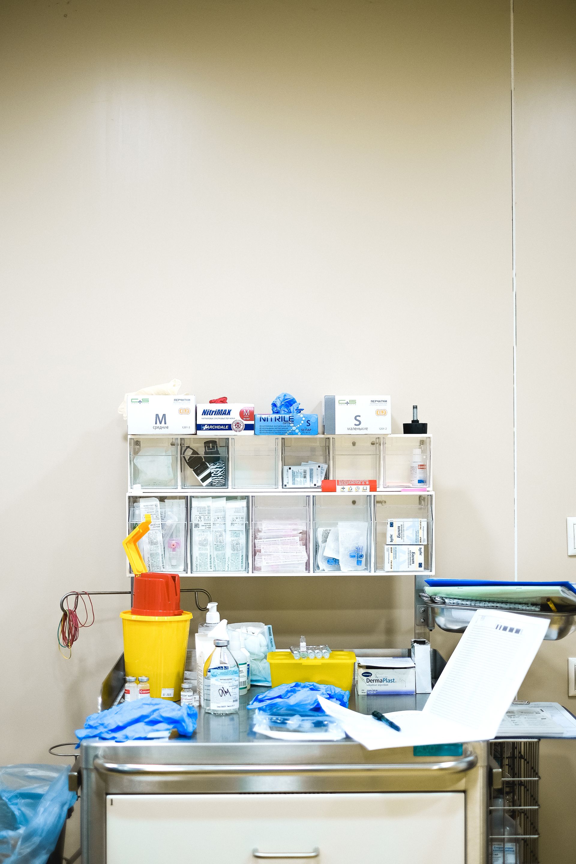 Hospital medical supply station with gloves, nitrile boxes, and clinical supplies